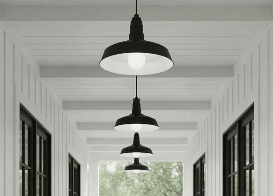 The Carson pendant lights on a black cord in matte black