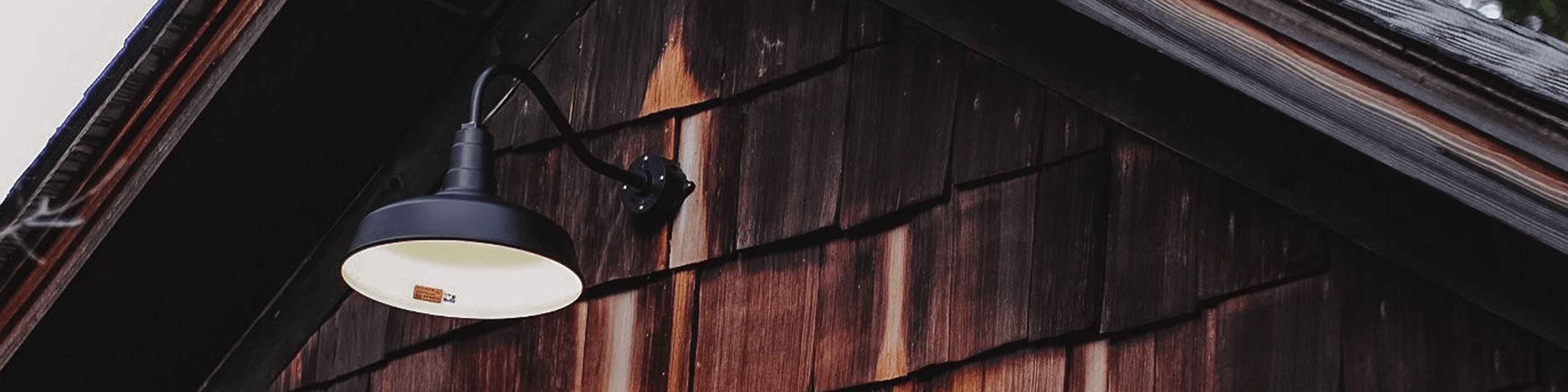 UL-approved barn-style wall light on wood siding