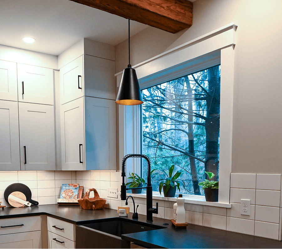 Steel lighting above a kitchen sink