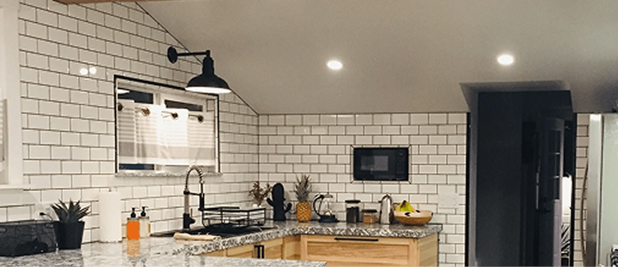 Wall lighting beside a kitchen sink