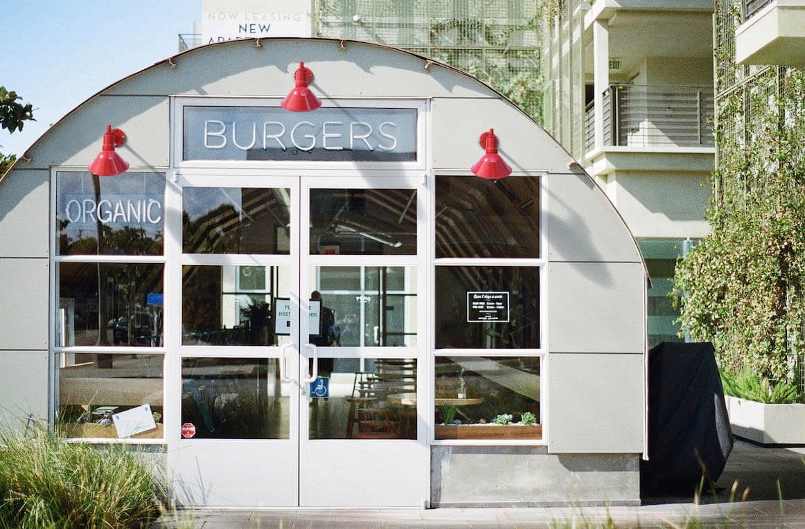 Red modern farm steel lighting on a burgers store front