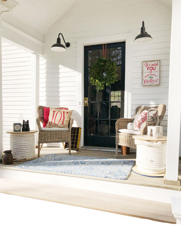 Porch with two gooseneck sconces from Steel Lighting Co.