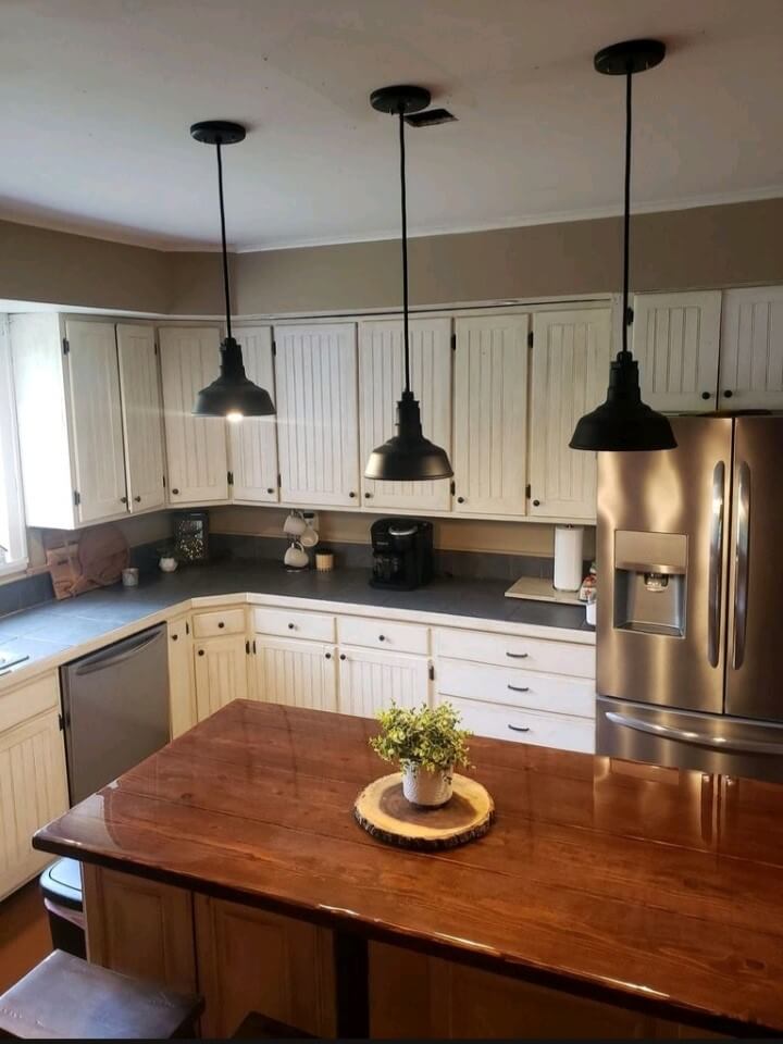 The Inglewood small pendant lights hanging over kitchen island