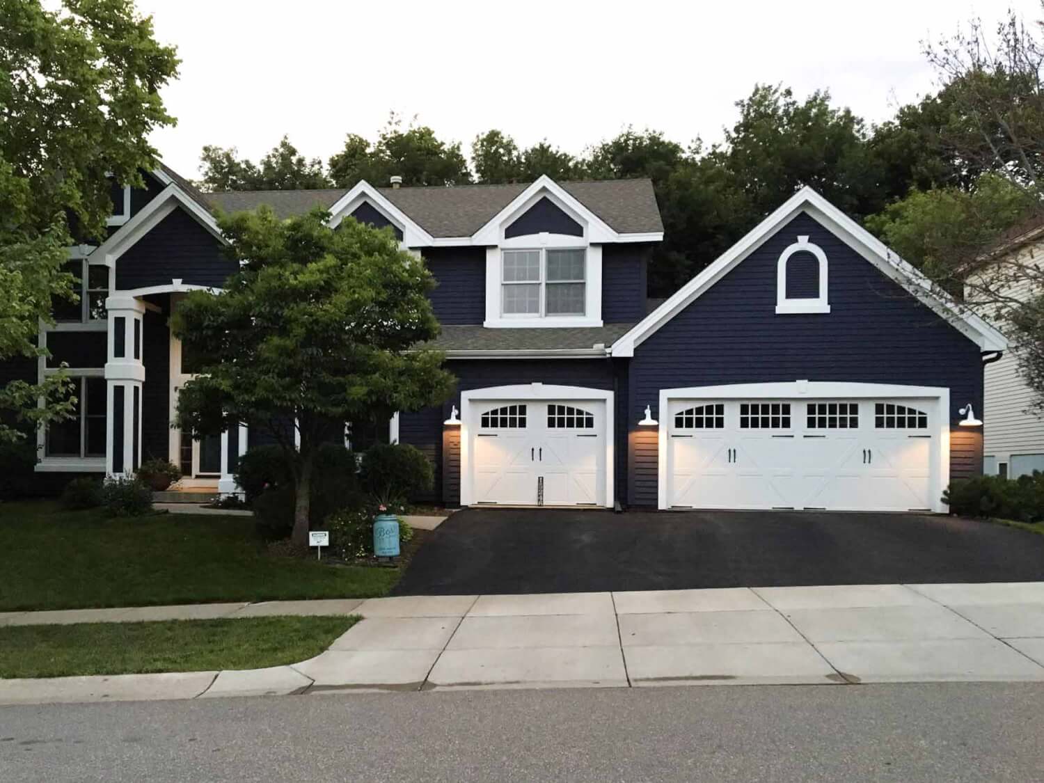 White Garage Lights on Exterior of Home