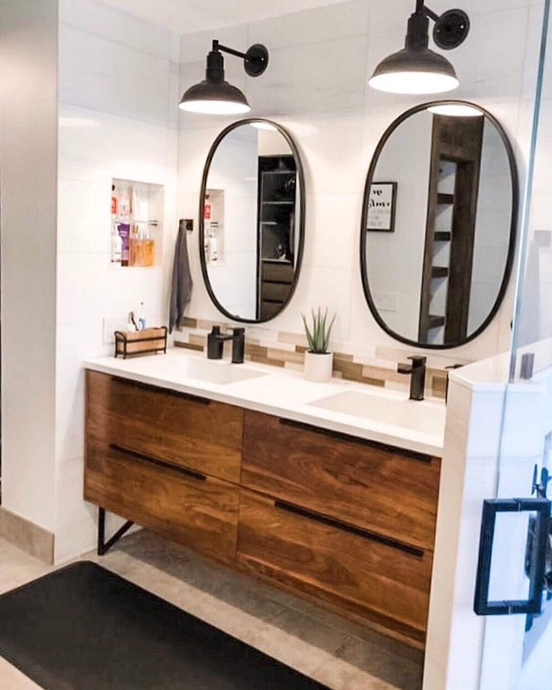 A glossy black Westchester Light on a Vanity Table