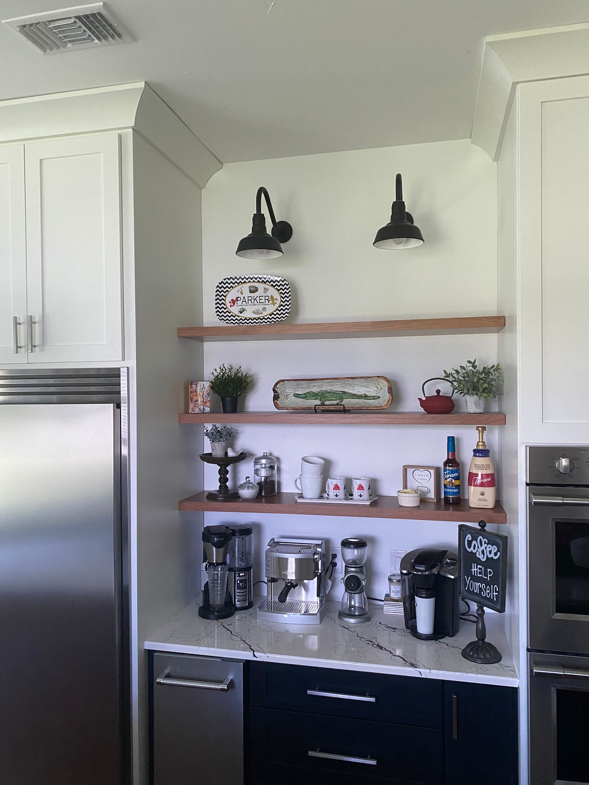 The Hawthorne Gooseneck Light highlighting a coffee station for guests.